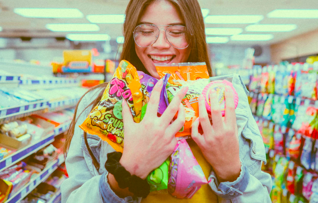 Woman holding bags of candies